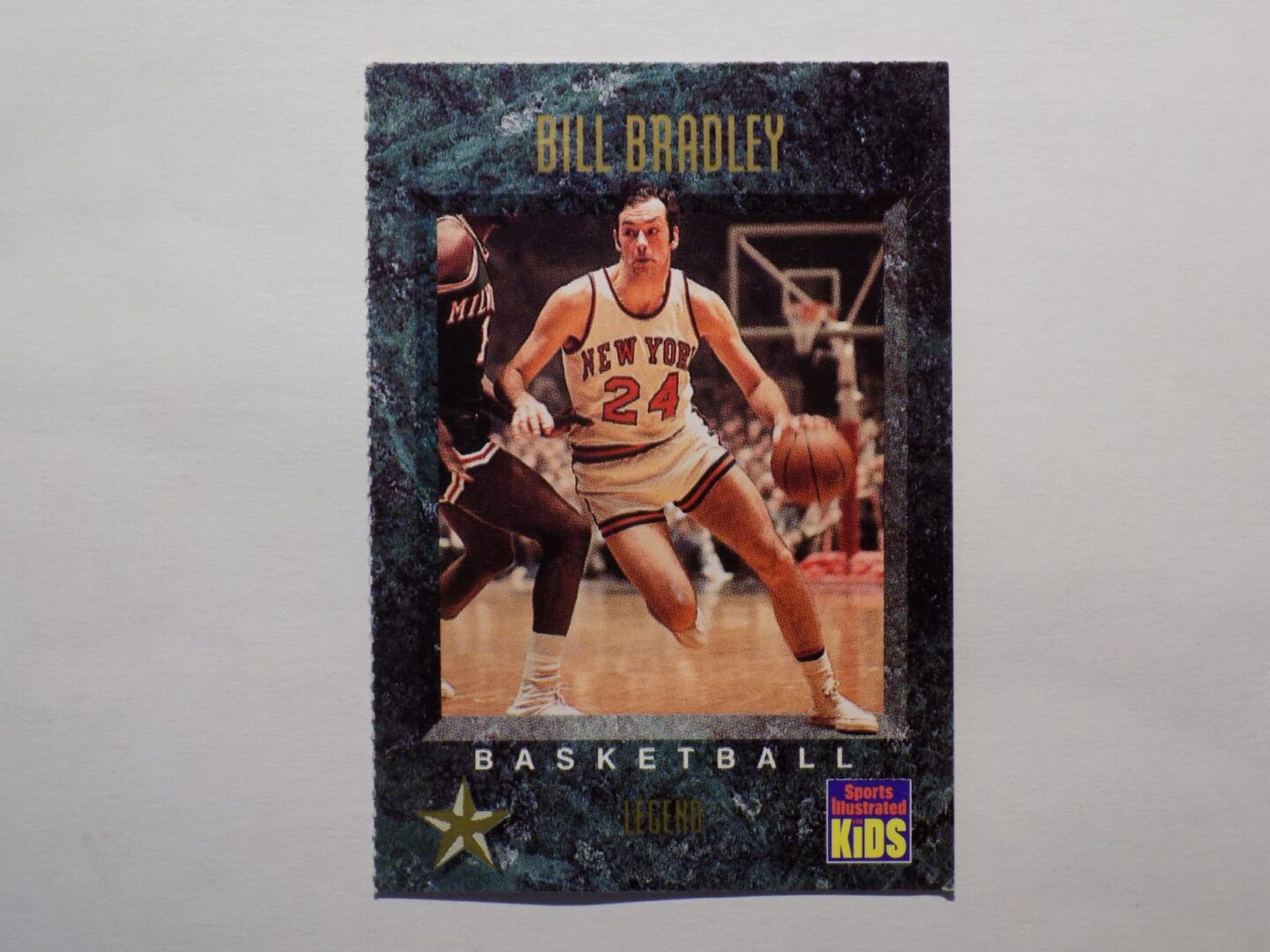 A Bradley, Bill basketball card with a picture of a player.