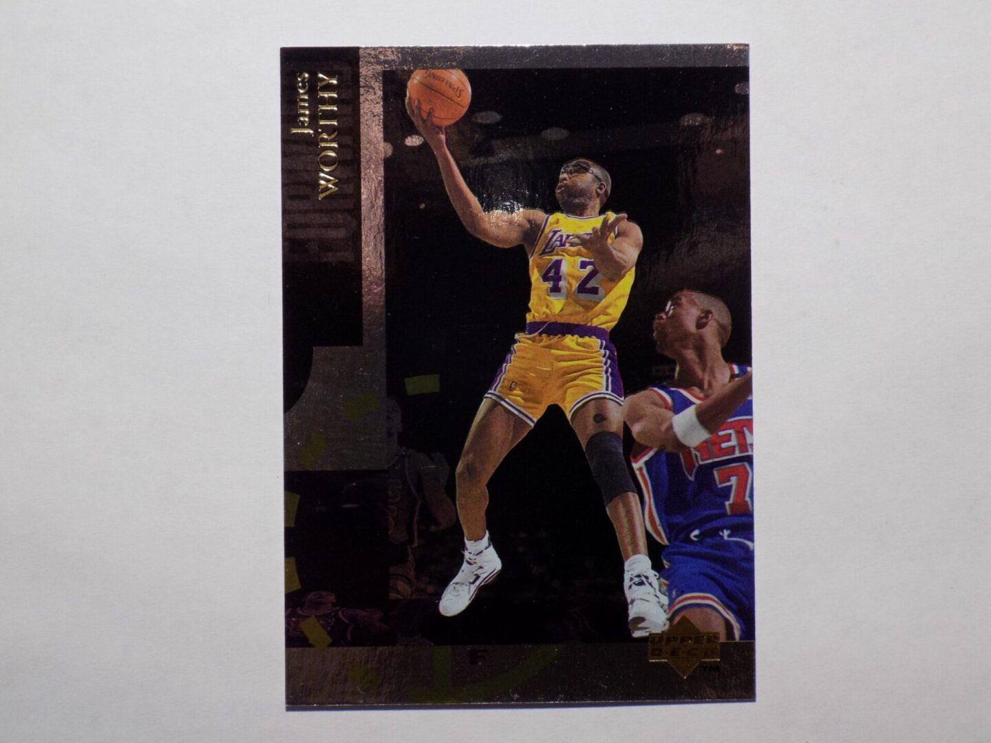 A basketball card with a picture of Worthy, James.