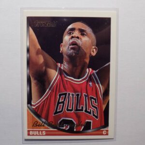 A basketball card with Bill Cartwright on it.