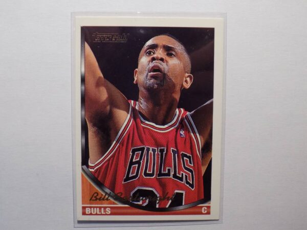 A basketball card with Bill Cartwright on it.