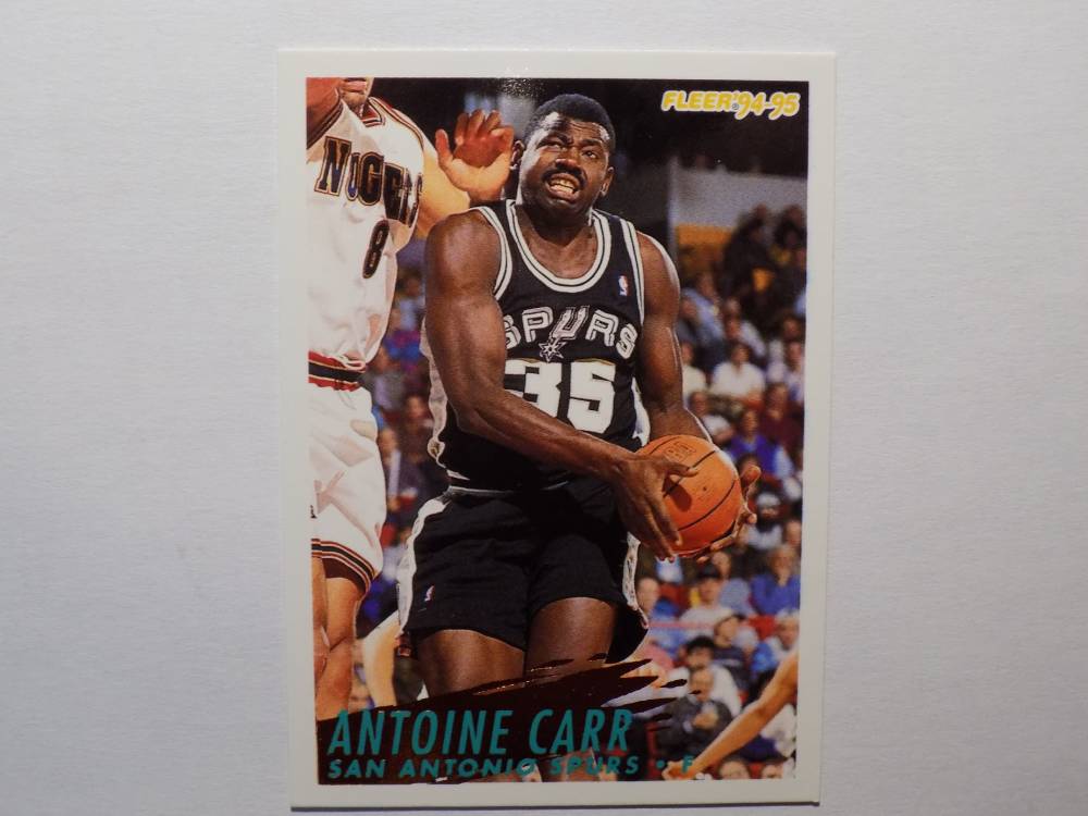 A basketball card with an image of Carr, Antoine, a San Antonio Spurs player.