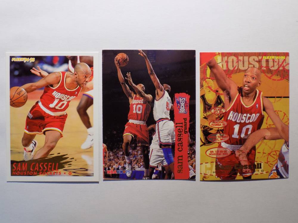 Three Cassell, Sam basketball cards with different players on them.