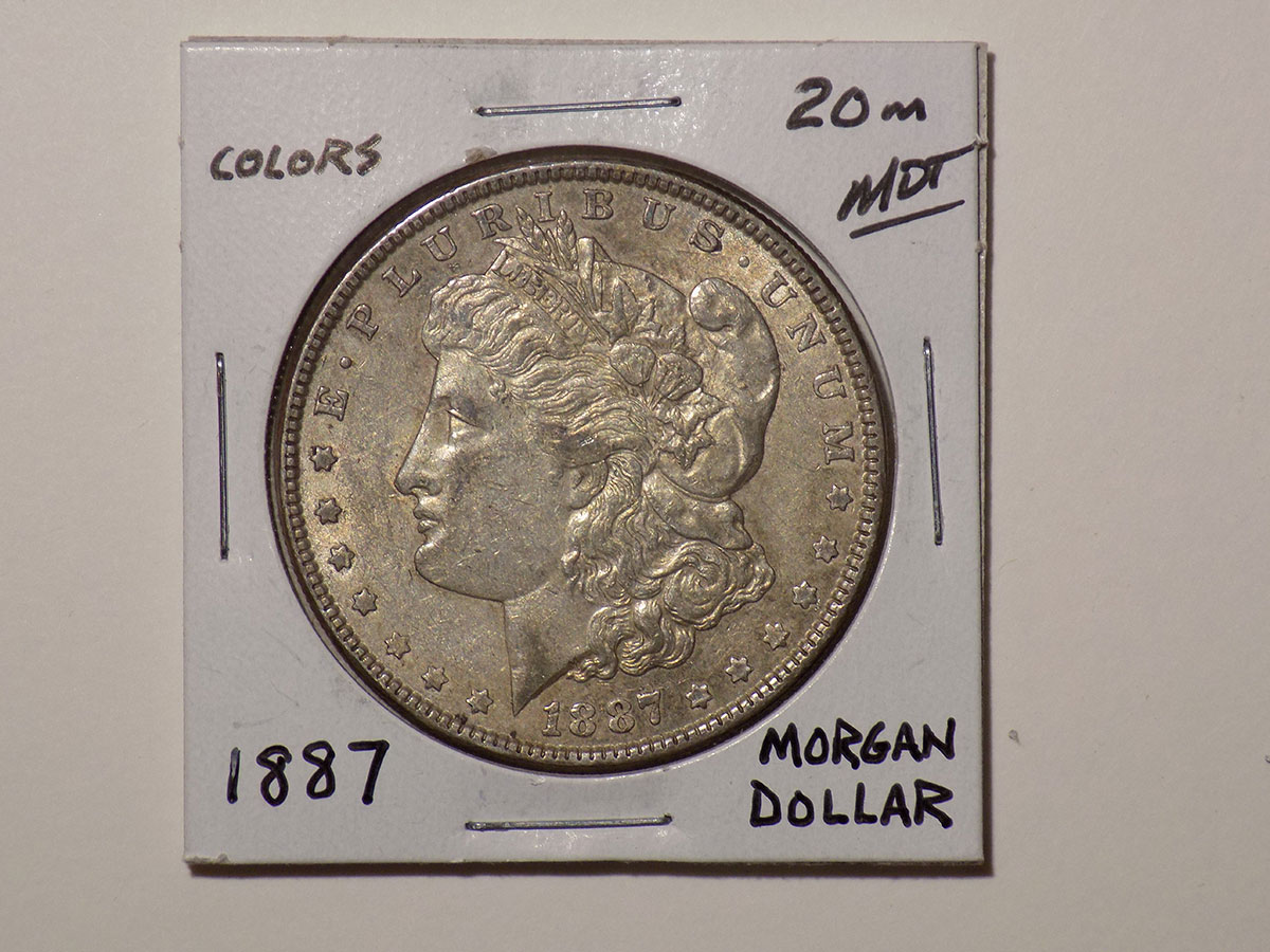 1887 Morgan silver dollar coin.