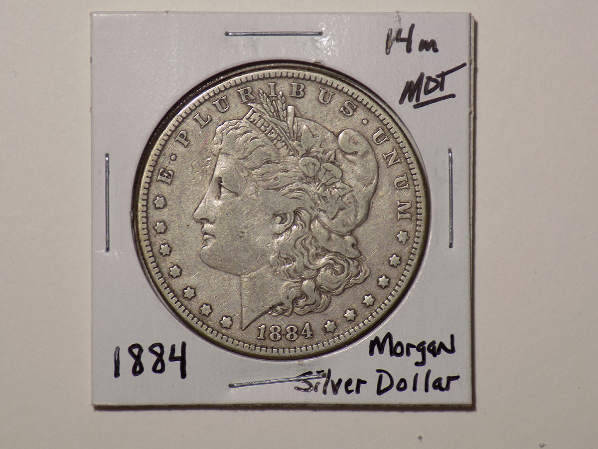 1884 Morgan silver dollar coin.