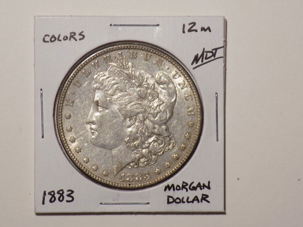 1883 Morgan silver dollar coin.