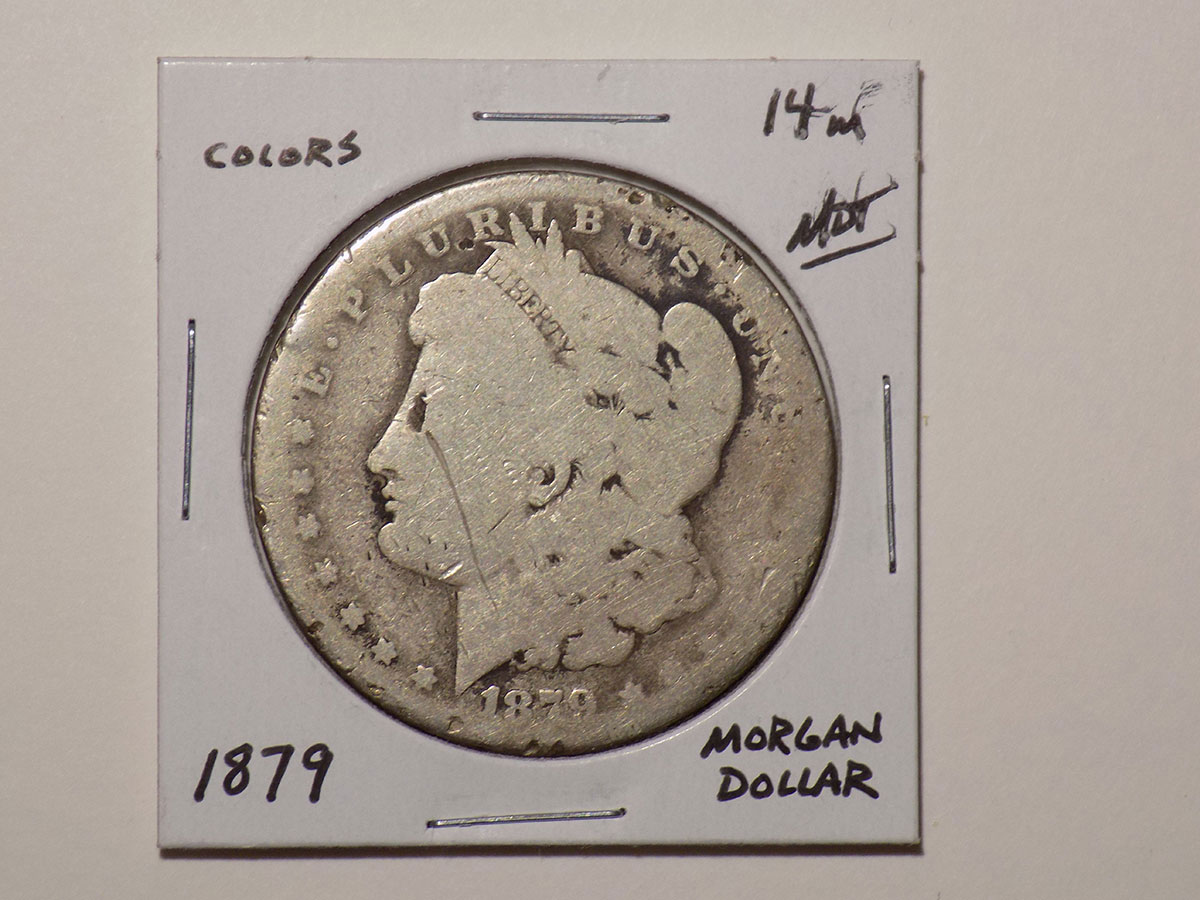 1879 Morgan silver dollar coin.