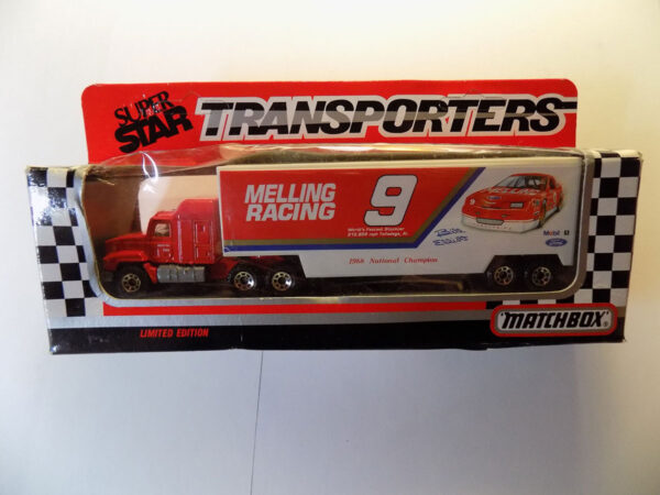 Matchbox red truck hauling race car.