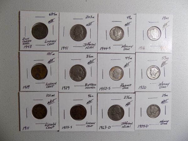 Collection of US coins in protective cases.