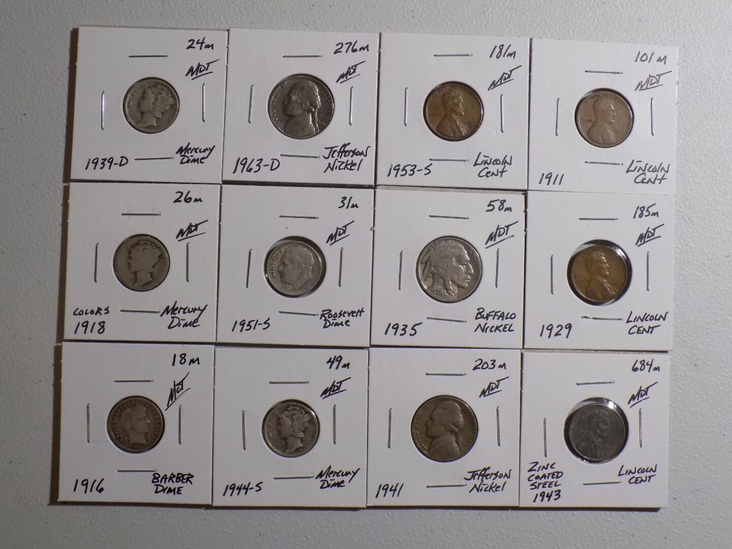 Collection of US coins in plastic holders.