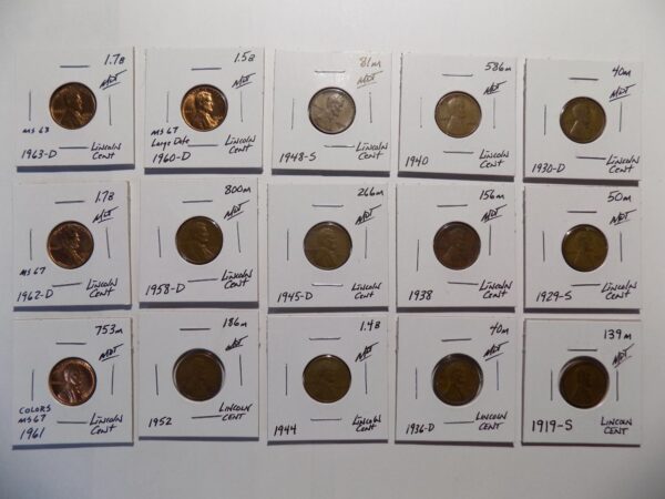 Collection of Lincoln penny coins in holders.