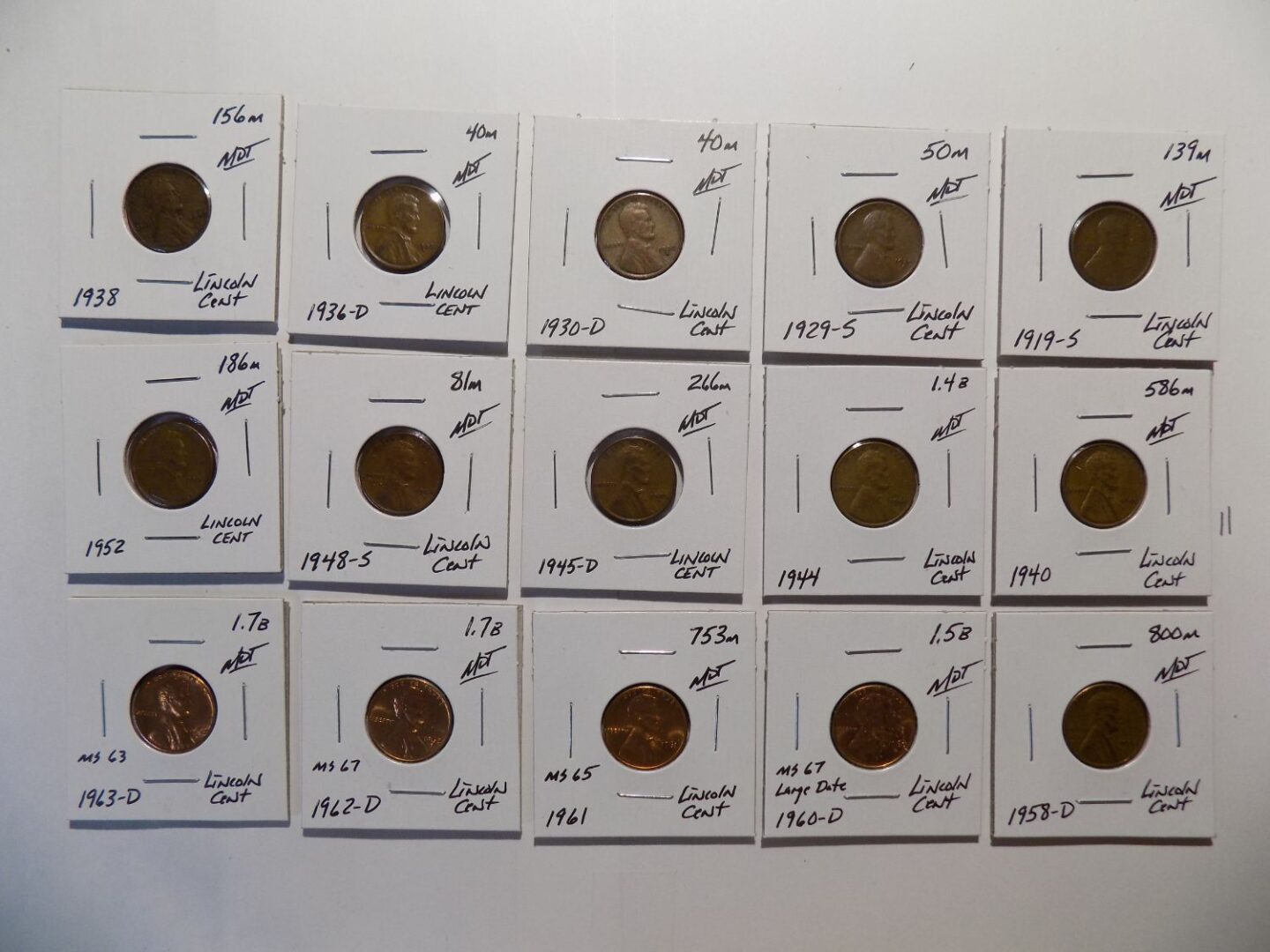 Collection of Lincoln pennies on cards.