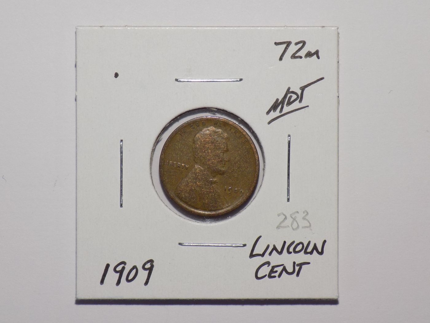 1909 Lincoln Wheat Penny in slab.