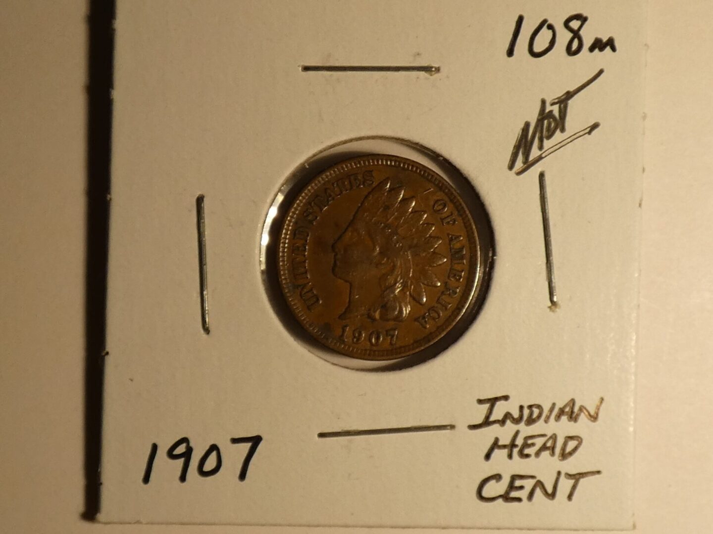 1907 Indian Head one cent coin.