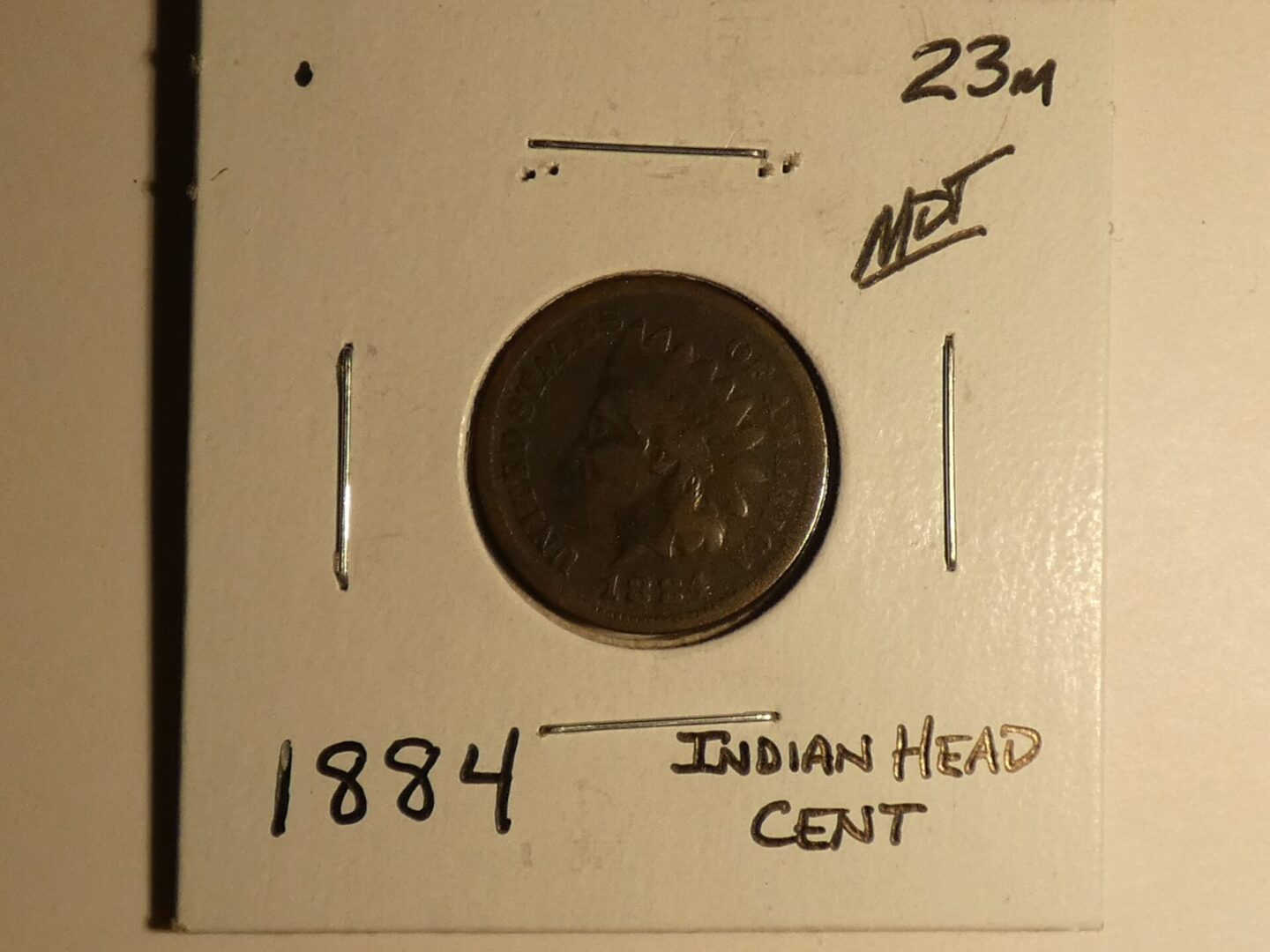 1884 Indian Head copper cent coin.