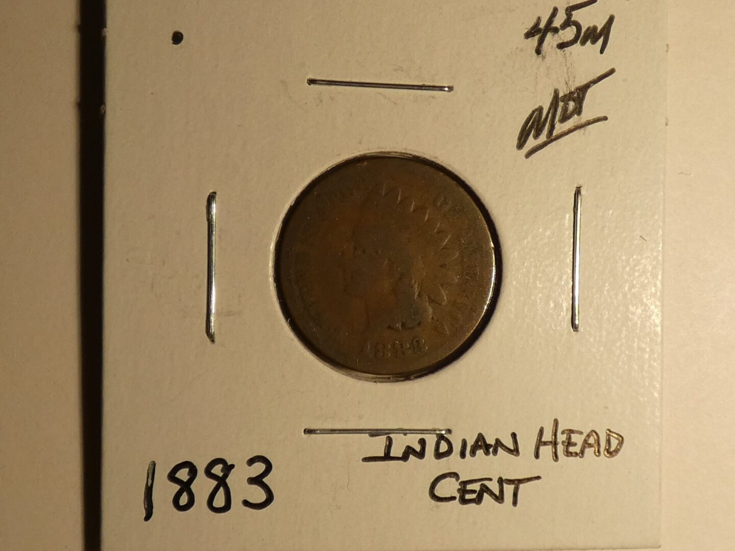 1883 Indian Head copper cent coin.