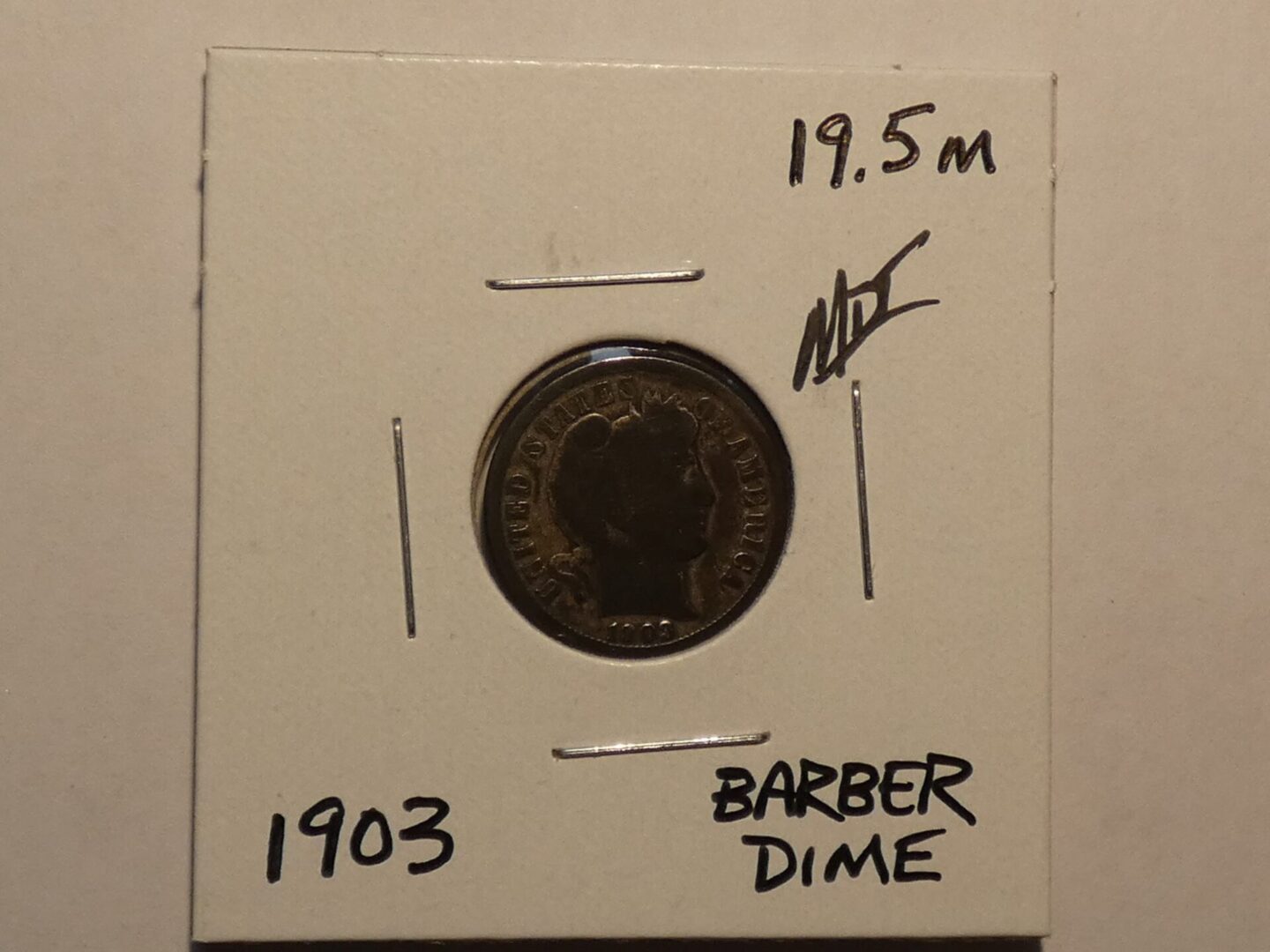 1903 Barber Dime coin in holder.