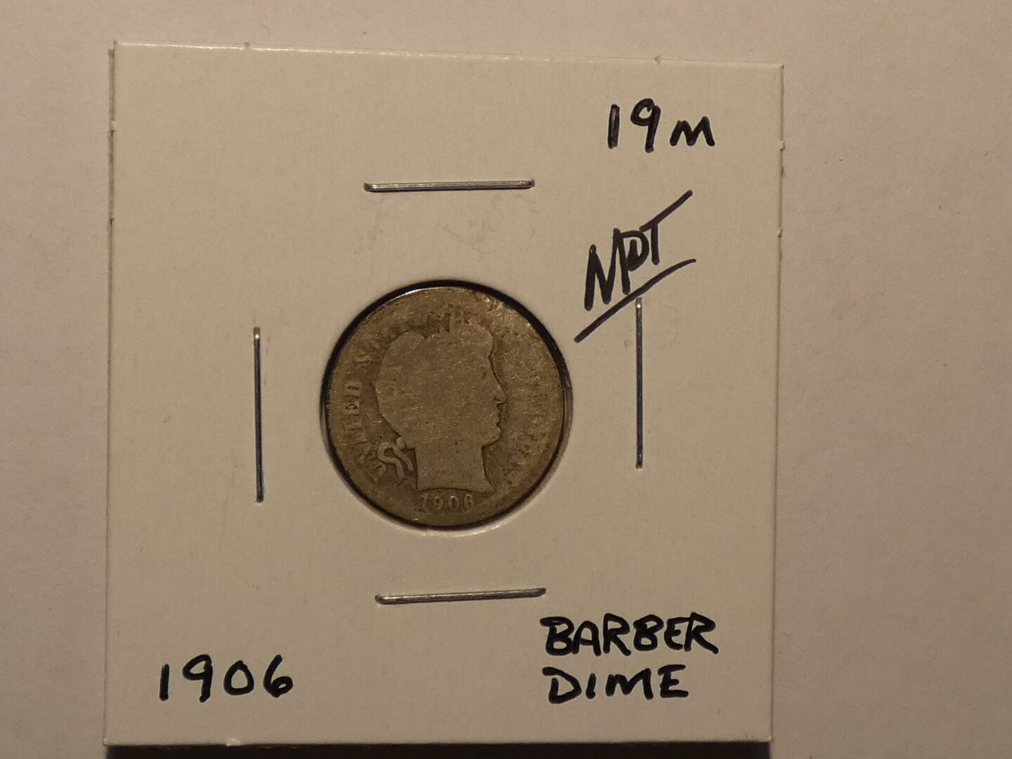 1906 Barber dime coin.