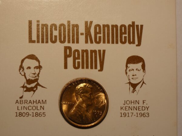 Lincoln-Kennedy penny with profiles of presidents.