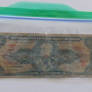 Two cruzeiros bill from Brazil in plastic bag.