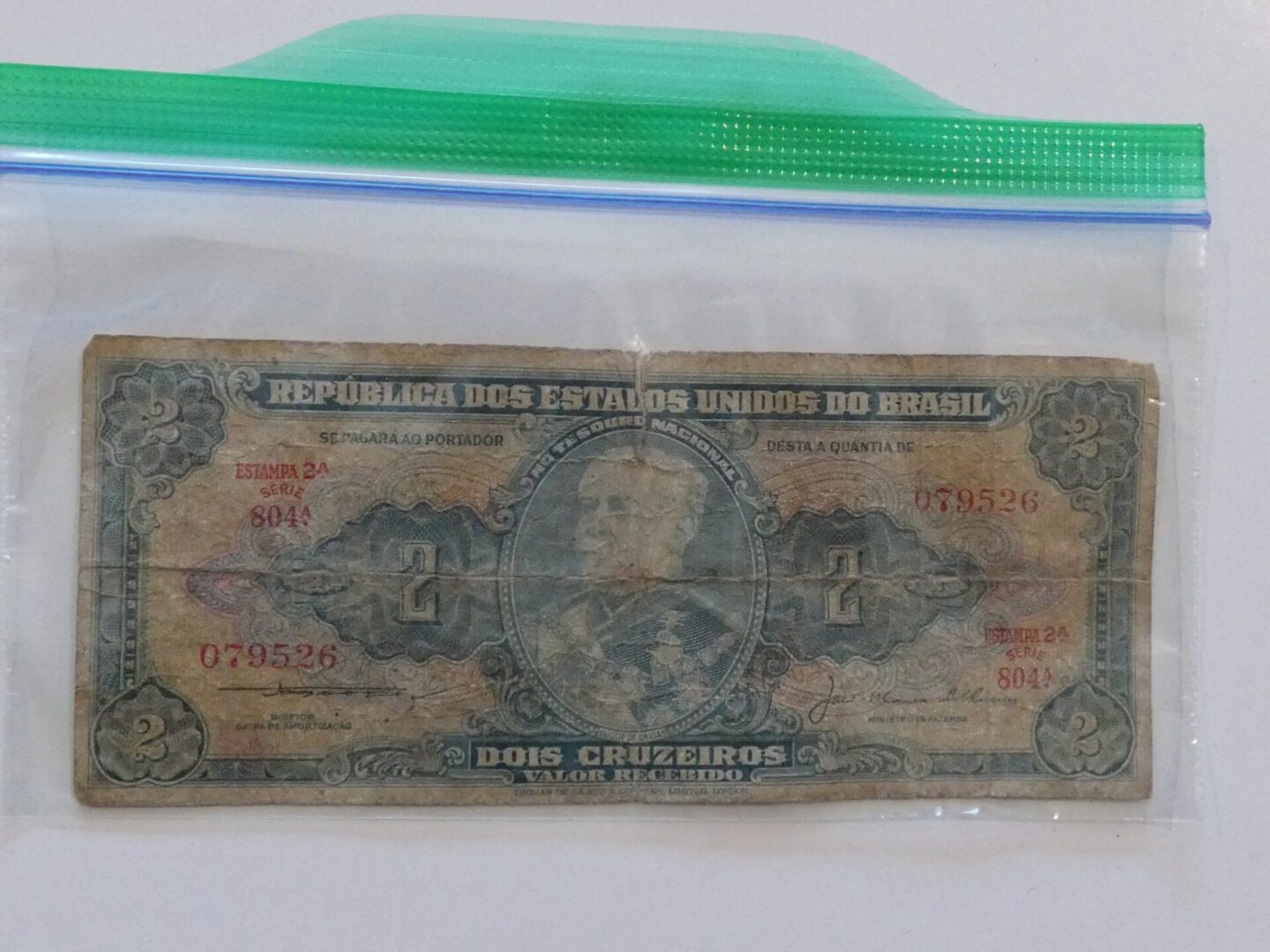 Two cruzeiros bill from Brazil in plastic bag.