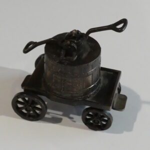 Vintage metal pencil sharpener on wheels.