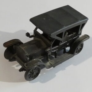 Black toy car with four wheels.