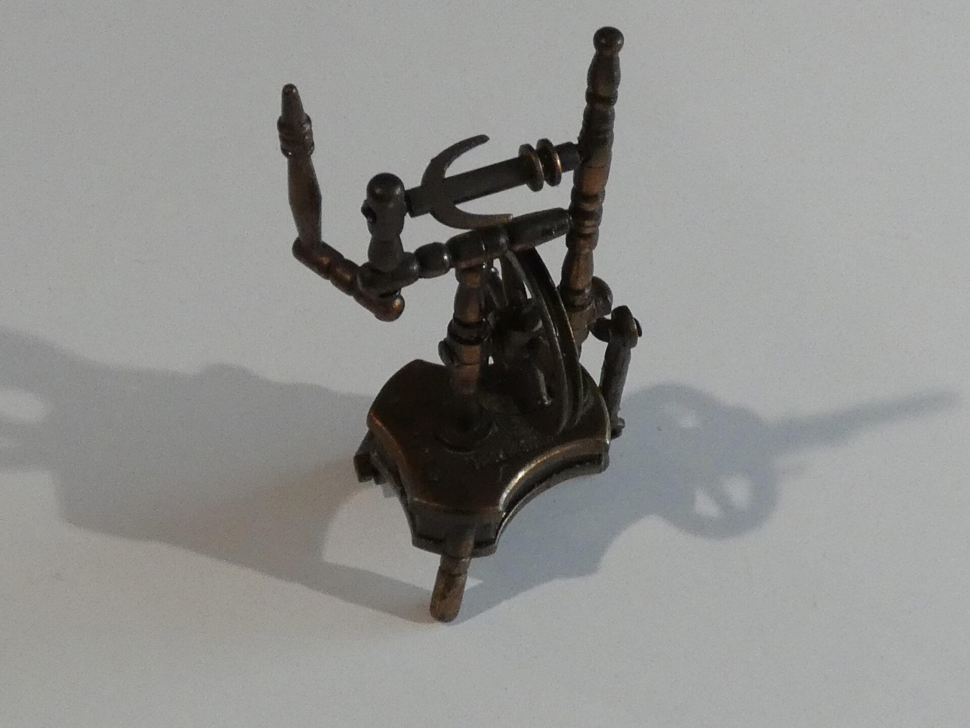 Vintage metal spinning wheel pencil sharpener.