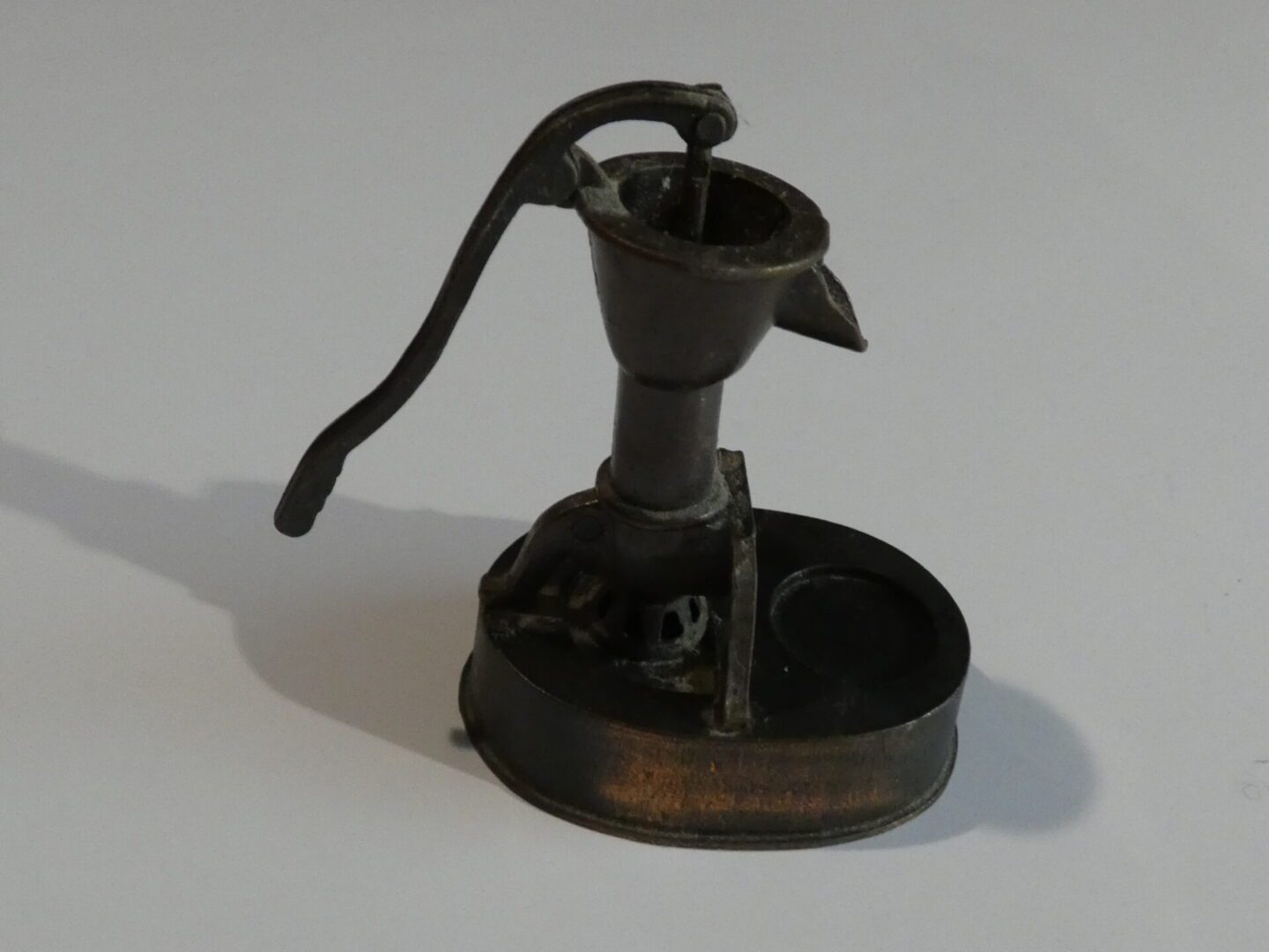 Vintage well pump pencil sharpener.