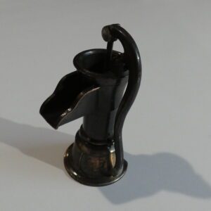 Black metal well pump pencil sharpener.