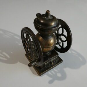 Antique metal coffee grinder pencil sharpener.