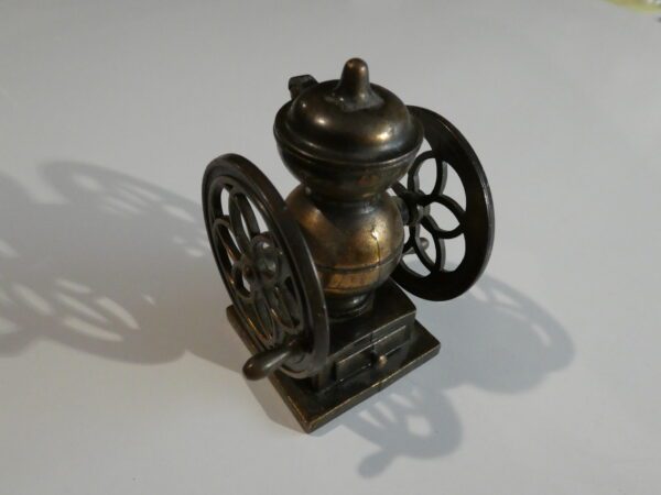 Antique metal coffee grinder pencil sharpener.