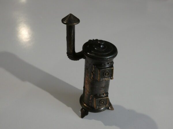 Vintage metal stovetop pencil sharpener.