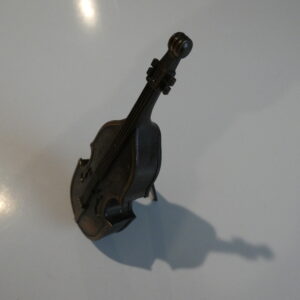 A small metal double bass figurine.