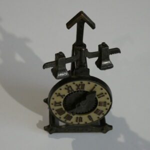 Clock-shaped pencil sharpener with gears.