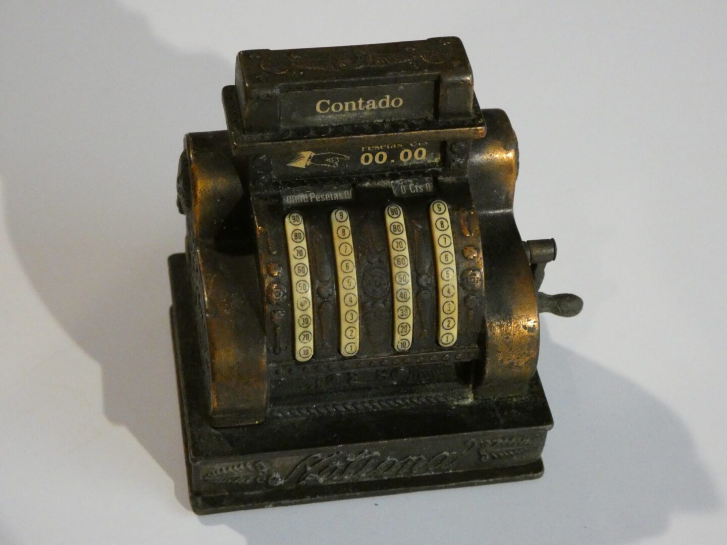 Antique metal cash register pencil sharpener.