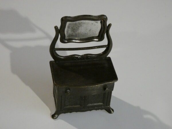 Antique metal vanity with mirror.