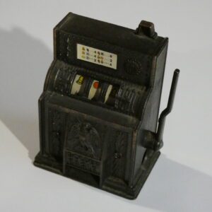 Vintage metal slot machine pencil sharpener.