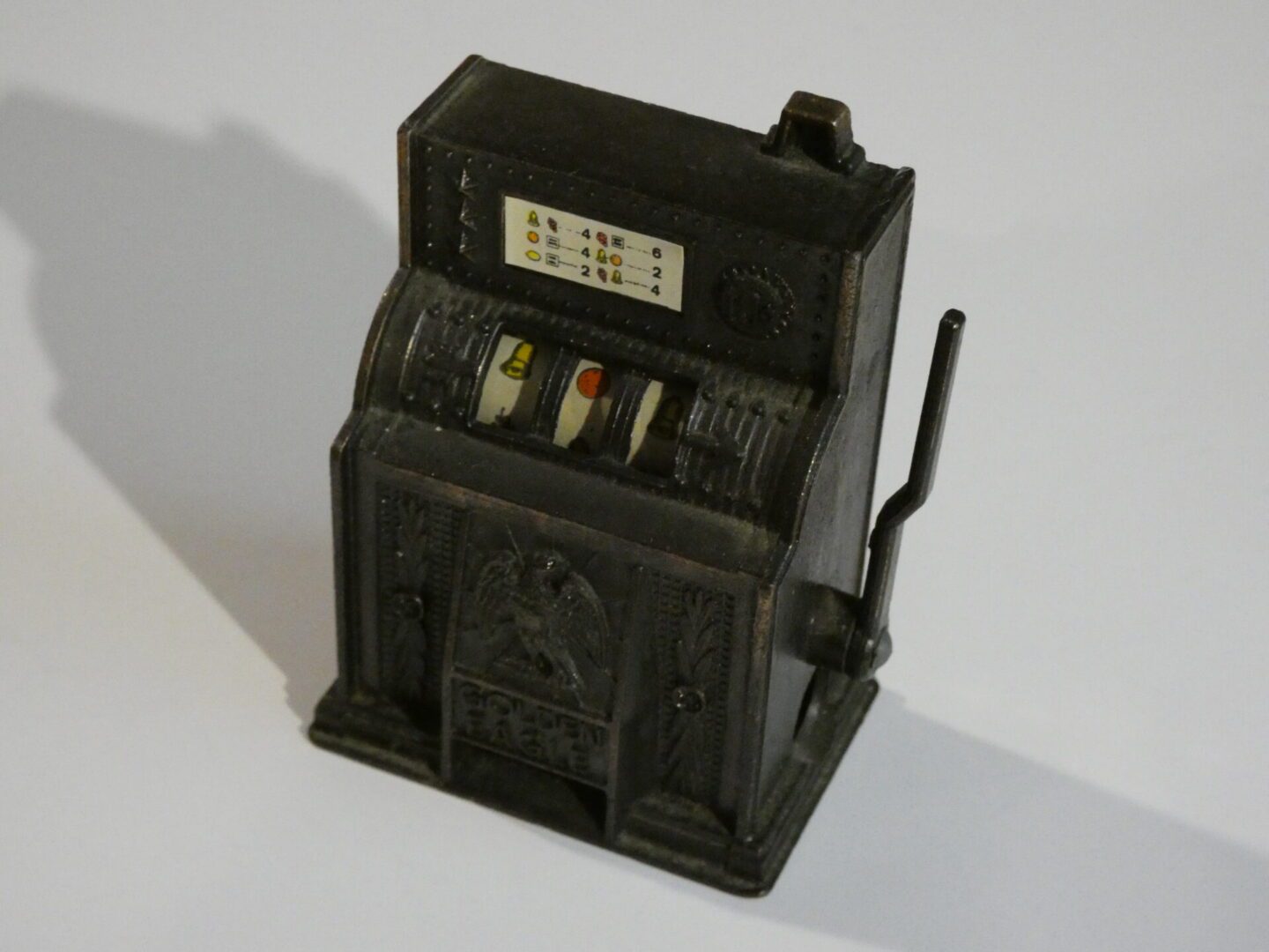 Vintage metal slot machine pencil sharpener.