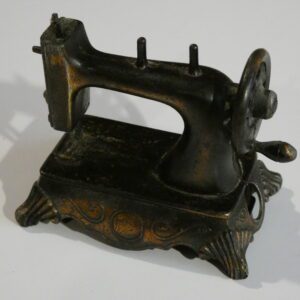 Vintage metal sewing machine pencil sharpener.