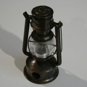 Metal oil lamp pencil sharpener.