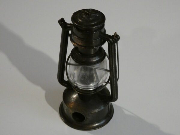 Metal oil lamp pencil sharpener.