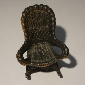 Miniature rocking chair made of metal.