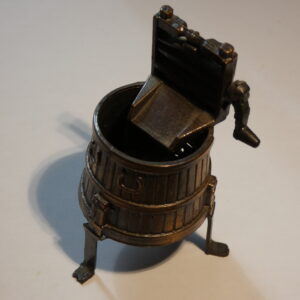 Vintage metal pencil sharpener in bucket shape.