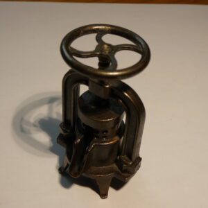 Vintage metal pencil sharpener with wheel.