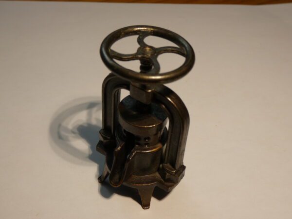 Vintage metal pencil sharpener with wheel.