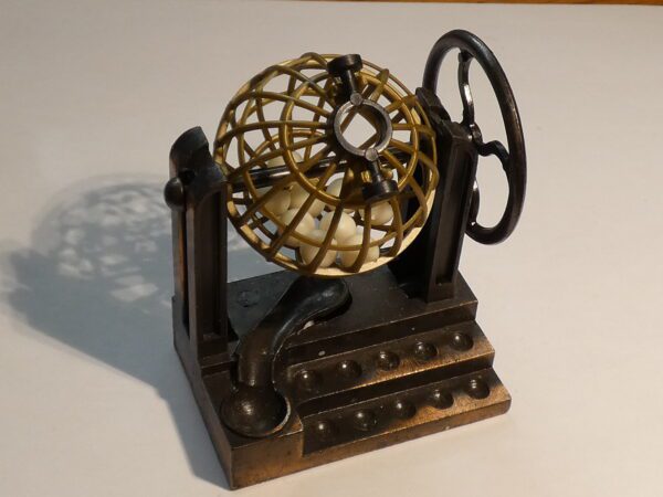 Metal lottery ball pencil sharpener.