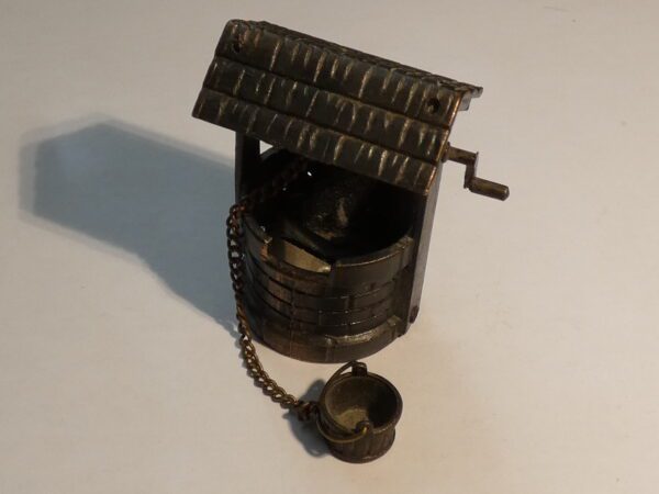 Metal well pencil sharpener with bucket.