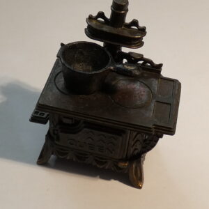 Vintage metal stovetop pencil sharpener.