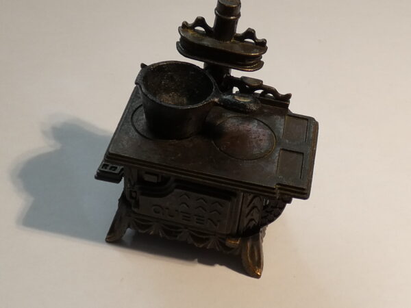 Vintage metal stovetop pencil sharpener.