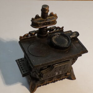 Antique metal stovetop pencil sharpener.